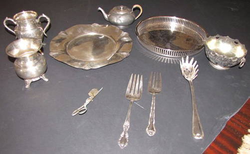 12 PIECES OF MISCELLANEOUS SILVER PLATE ITEMS 4588A: Lot of 12 miscellaneous pieces of silver plate items including 2 trays, a candle snuffer, 2 forks and 4 tea pot pieces. Many makers on the pieces.