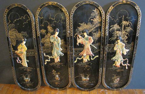 4 PART OVAL WALL HANGINGS WITH ASIAN SCENES 1533: 4 part black lacquered oval wall plaques with Asian scenes and gold painted detailing. The figures on the plaques are made of a soft stone. Each plaque is 36"H x 12"W