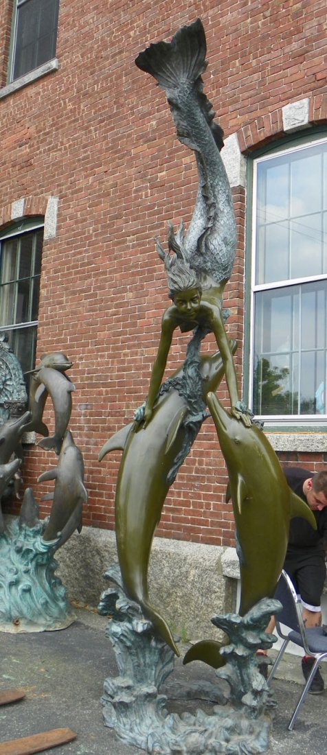 EXTRA LARGE 2 TONE BRONZE FOUNTAIN W/ DOLHPINS 5098: Extra large two tone bronze fountain featuring 2 full-size dolphins facing up with large mermaid extending her tail in the air. The mermaid is connected with bolts at each of her hands and there is lo
