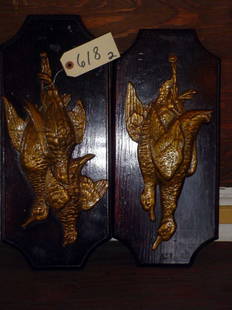 PAIR HANGING GAME PLAQUES W METAL&WOOD 618: Pair of hanging game plaques in gold finish white metal with wood back plate. LOT # 618 Dimensions: 17.5" H x 7" W Age: C. 1900 Material: White Metal & Wood