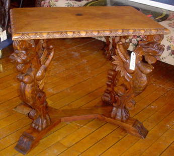 WINGED GRIFFIN TABLE W/INCISED DETAIL 13777: Marvelous carved winged griffin table with incised detailing and egg and dart trim. LOT # 13777 Dimensions: 28" H x 32" W x 21" D Age: C. 1890 Material: Wood