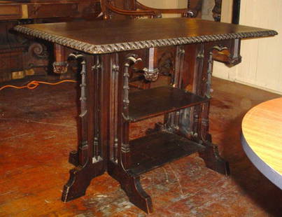 CVD OAK GOTHIC TABLE NICELY DETAILED 13778E: Fantastic carved oak three tier Gothic table with ornately arched motif sides. LOT # 13778E Dimensions: 28.5" H x 43" W x 25" D Age: C. 1880 Material: Oak