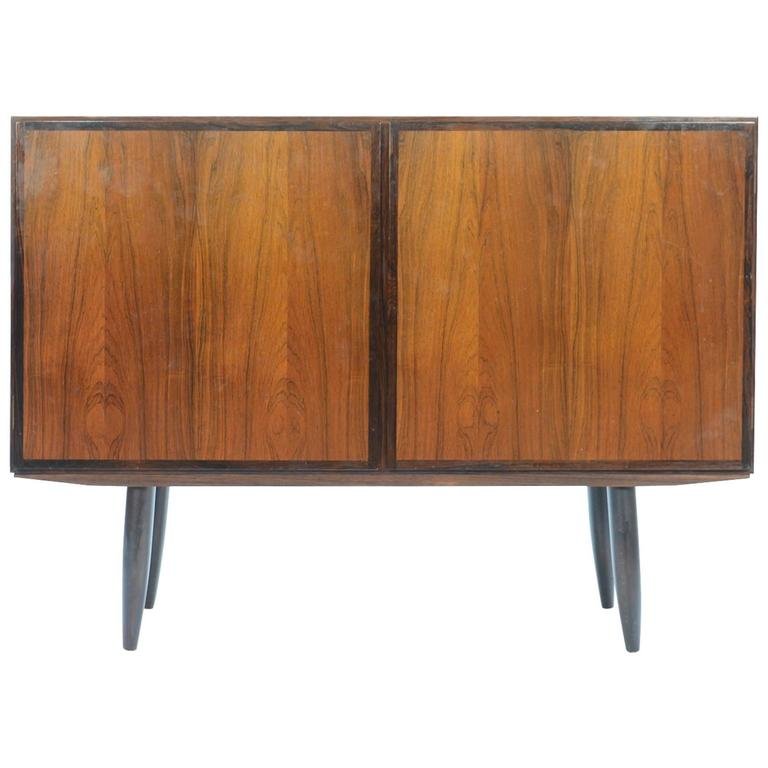 Gunni Omann for Omann Jun Rosewood Two-Door Sideboard: A beautifully-grained Gunni Omann for Omann Jun Rosewood two-door sideboard, revealing one adjustable shelf on the right and two on the left.Among collectors, Gunni's sideboards remain Omann Jun's mos