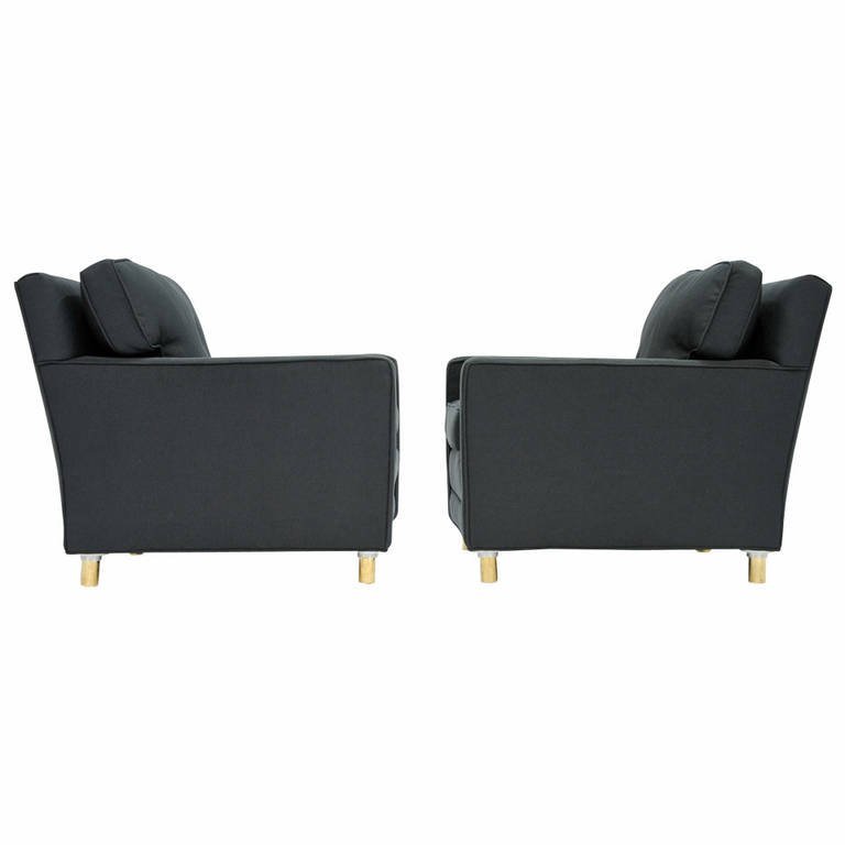 A Classic Pair of Edward Wormley for Dunbar Club Chairs: A classic pair of Edward Wormley club chairs designed for Dunbar. These wonderful chairs feature solid brass legs and Henry Calvin ribbed fabric upholstery. Arm height is 20.25 in. 29 in.Hx28.5 in.Wx3