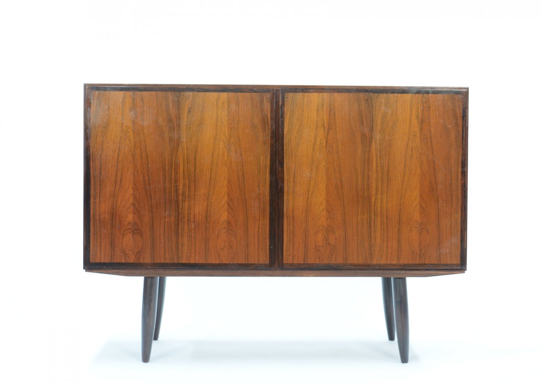 Gunni Omann for Omann Jun Rosewood Two-Door Sideboard: A beautifully-grained Gunni Omann for Omann Jun Rosewood two-door sideboard, revealing one adjustable shelf on the right and two on the left.Among collectors, Gunni's sideboards remain Omann Jun's mos