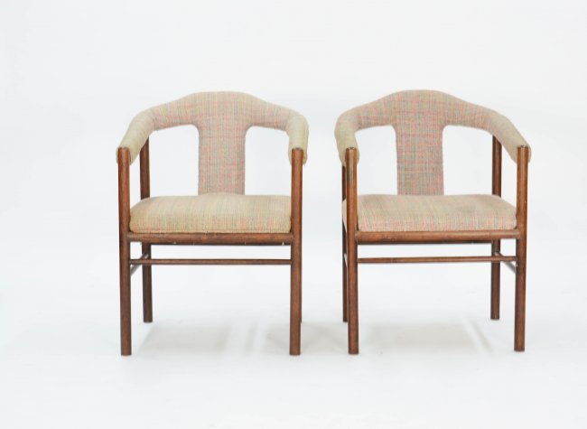 A Pair of Rosewood Arm Chairs After Arne Vodder: Two simple Brazilian rosewood chairs with elegantly curved arms in the with the refinement of Vodder's designs. 31 in. H x 23 in. W x 22 in. D Seat Height 17 in. Arm Height 25 in.