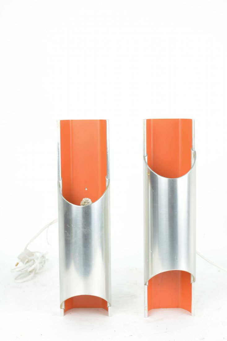 A Pair Bent Karlby Pan-Opticon Sconce for Lyfa: A pair of Scandinavian Modern "Pan-Opticon" sconces in polished aluminium with orange lacquer. Designed by Bent Karlby for Lyfa, Denmark, 1968. The tubular form hold two candelabra base sockets. 14" H