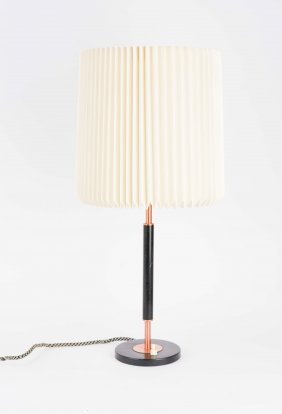 A Desk Lamp in Copper and Black after Le Klint: a desk lamp after Robert Kasal for Le Klint. 24" H 10.5 diameter.