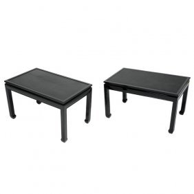 Pair of Stunning End Tables after Paul Laszlo: A stylish pair of end tables in the manner of Paul Laszlo with 'floating' leather tops. Refinished in black lacquer. Stunning, understated elegance.18 in.Hx29.75 in.Wx18 in.D