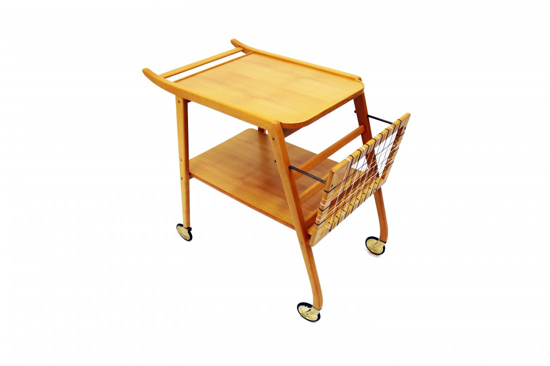 Mid-Century Swedish Breakfast Cart: A delightful Mid-Century Swedish breakfast cart with a webbed newspaper/magazine compartment. Dimensions: H 25 in. x W 27.5 in. x D 15.75 in. The handles are 25.75 in. H. PLEASE NOTE: Pickup for this