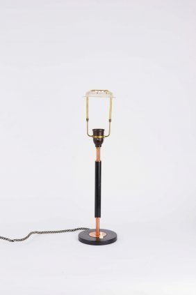 A Desk Lamp in Copper and Black after Le Klint: a desk lamp after Robert Kasal for Le Klint. 24" H 10.5 diameter.