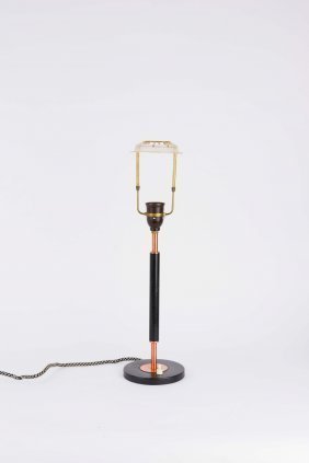 A Desk Lamp in Copper and Black after Le Klint: a desk lamp after Robert Kasal for Le Klint. 24" H 10.5 diameter.