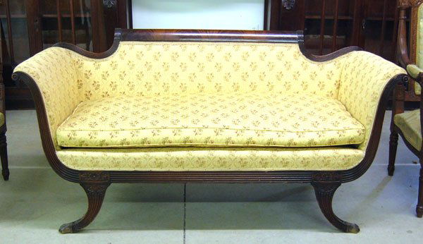Duncan Phyfe style sofa with flame grained top rai: Duncan Phyfe style sofa with flame grained top rail and brass claw feet. 31''h x 62''w x 25''d.