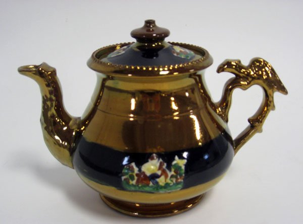 Small lustre cobalt teapot with bird handle and blu: Small lustre cobalt teapot with bird handle and blue band embossed trim. Circa 1820-1825. Small chip on spout. 4 5/8''h.