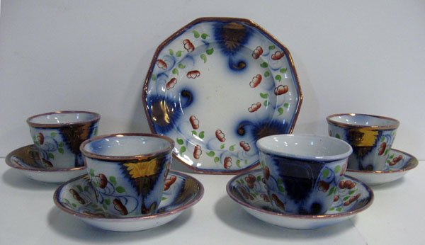 Gaudy Ironstone set of nine pieces, four cups and : Gaudy Ironstone set of nine pieces, four cups and saucers and cake plate. Minor damage to glaze and one cup has a hairline.