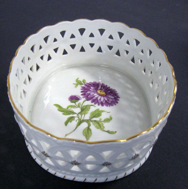 Reticulated bowl. European reticulated bowl with a: Reticulated bowl. European reticulated bowl with a hand painted floral center. Artist initialed and factory signed. Good condition. 2 1/2''h x 7 3/4''w x 6 1/2''d. $50-80