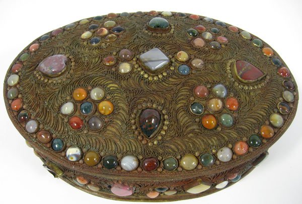 Jeweled wire box. A large wire applique box fitted: Jeweled wire box. A large wire applique box fitted with a multitude of semi precious stones on lid and sides. Appropriate age wear. 3 1/2''h x 12 3/4'' l x 10''d. $150-200