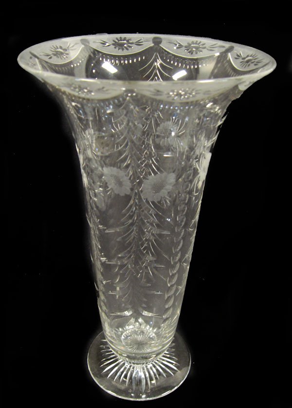 Cut glass vase. Pairpoint ''Wickham'' tall vase wi: Cut glass vase. Pairpoint ''Wickham'' tall vase with rayed base. Good condition. Appropriate age wear.12''h x 6 1/2''w at top. $150-200