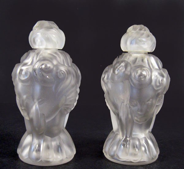 Glass perfume bottles. Pair of French Art Deco fro: Glass perfume bottles. Pair of French Art Deco frosted glass perfume bottles with Art Deco women faces. Ca 1920's. Appropriate age wear. 4 1/2''h. $150-250