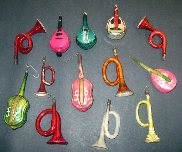 Thirteen antique Christmas instrument ornaments. Condit: Thirteen antique Christmas instrument ornaments. Condition varies from good to excellent. One horn is damaged. Appropriate age wear. $70-100