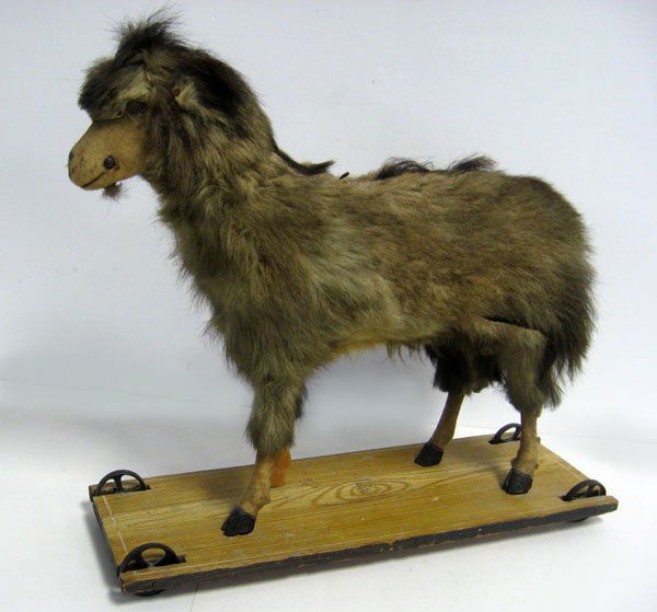 Antique toy goat on platform, 18''h. Good overall condi: Antique toy goat on platform, 18''h. Good overall condition with wear, missing glass eyes and bridle. Bleating bellows works. Repaired front leg. Note condition. Appropriate age wear. $200-250