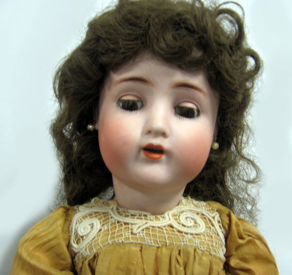24'' doll Alt, Beck, & Gottschalek 1362. German bisque: 24'' doll Alt, Beck, & Gottschalek 1362. German bisque head, open mouth with teeth, pierced ears. Wig chips, chip left ear, right cheek rub, no cracks. German compo body with wear. Old dress. New wig.