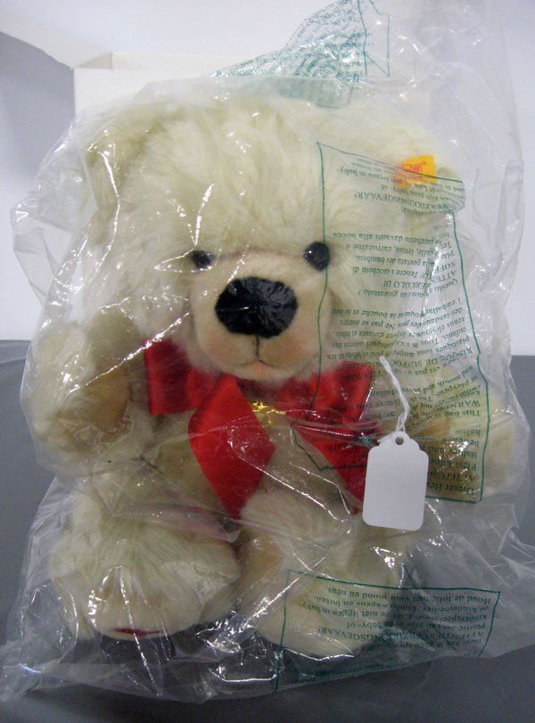 Teddy Bear. 16'' Steiff Danbury Mint bear with heart pe: Teddy Bear. 16'' Steiff Danbury Mint bear with heart pendant, 668340. Bear is cream colored, Valentine, heart on foot, mint in box. Similar to a ''Petsy''. Note box crushed on corner. Appropriate age