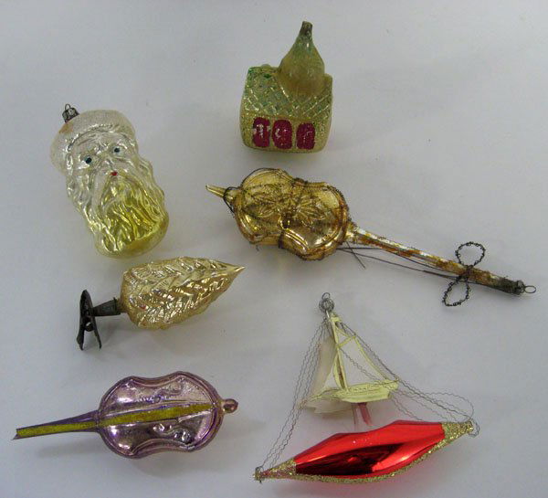 Six antique Christmas ornaments. Condition varies. Smal: Six antique Christmas ornaments. Condition varies. Small viola, church, and sail boat have end chips. Overall wear. Appropriate age wear. $