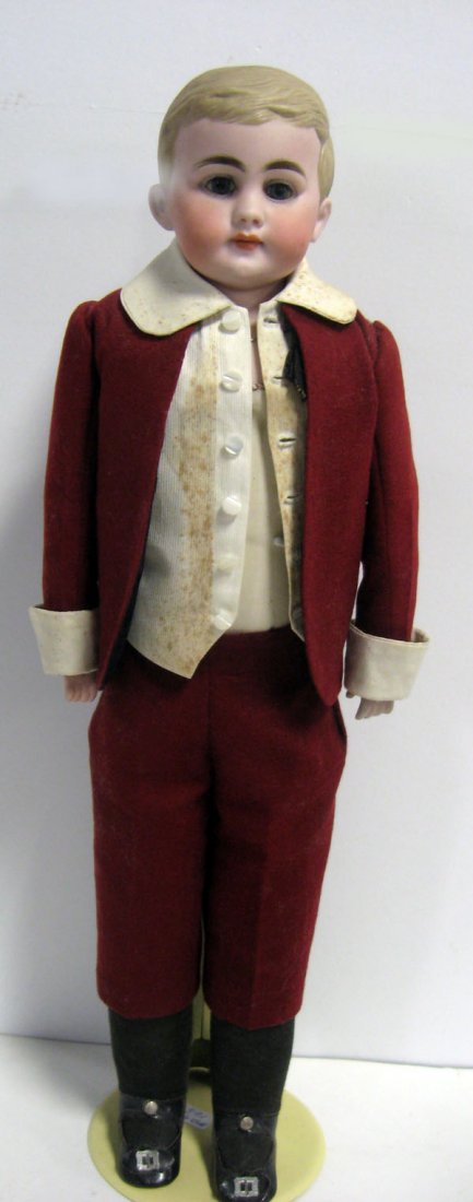 19'' doll American school boy. German bisque, molded ha: 19'' doll American school boy. German bisque, molded hair, solid dome, kid body. German bisque shoulder head, set glass eyes, molded blonde hair, closed mouth. Unmarked kid body, jointed knees, hips,