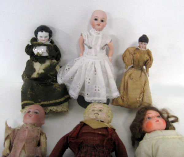Six misc. dolls 7''-14''. Bisque dollhouse doll, china,: Six misc. dolls 7''-14''. Bisque dollhouse doll, china, papier mache. Bisque head marked Germany. All others are unmarked. Two German bisque both set eyes, both five piece compo bodies with wear, clot