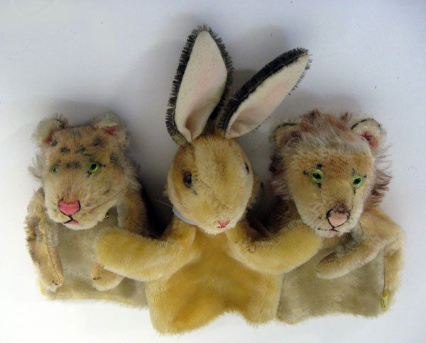Three vintage mohair hand puppets. Steiff rabbit with n: Three vintage mohair hand puppets. Steiff rabbit with no ID, and two Herman lions with tags. Various worn condition. Appropriate age wear.
