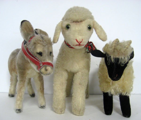 Three stuffed animals. 7'' Steiff billy goat, lamb, and: Three stuffed animals. 7'' Steiff billy goat, lamb, and donkey . All German mohair and have glass eyes. All are unjointed. Steiff donkey has script button and U.S. Zone Germany tag intact. No ID on la