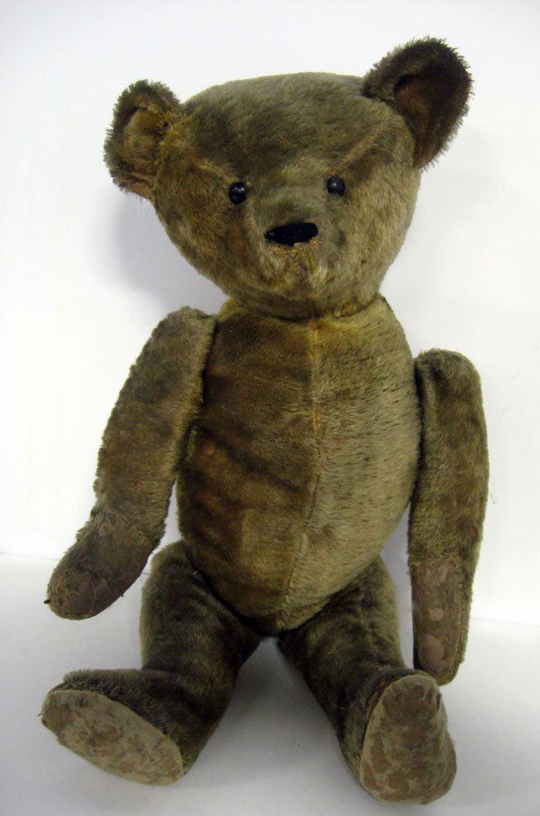 Teddy bear. 22'' American Ideal vintage gold mohair bea: Teddy bear. 22'' American Ideal vintage gold mohair bear, ca 1920-1930. Jointed, original shoe button eyes, excelsior stuffed, hump on back. No ID. Replaced and worn glued paw pads on feet and hands.