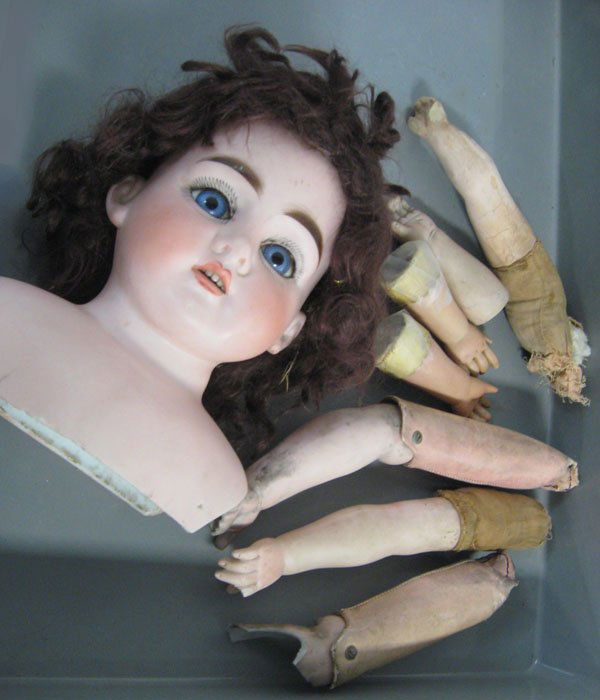 8'' German antique shoulder head and bisque arms and ha: 8'' German antique shoulder head and bisque arms and hands. German bisque head and shoulders, set eyes, open mouth with teeth. Wear on left eye brow, firing crack on shoulder front of left ear. bisque