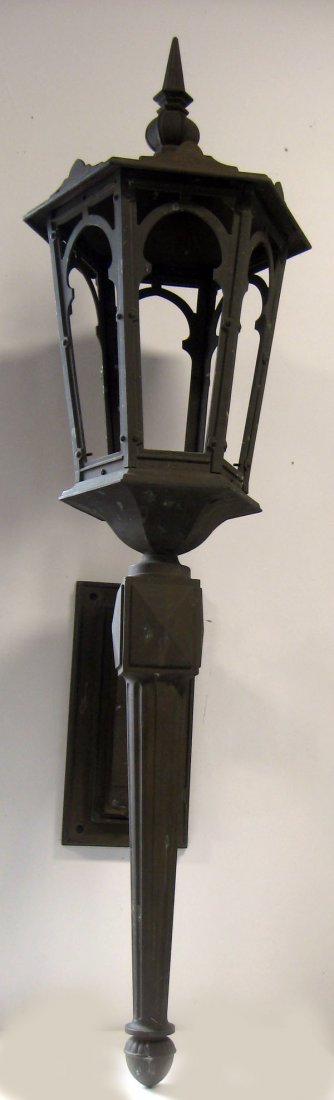 Pair of large bronze Architectural torch lanterns from: Pair of large bronze Architectural torch lanterns from the exterior of an old building in downtown Ashtabula, Ohio. Good as found condition. Glass and set screws for top are missing. Appropriate age w