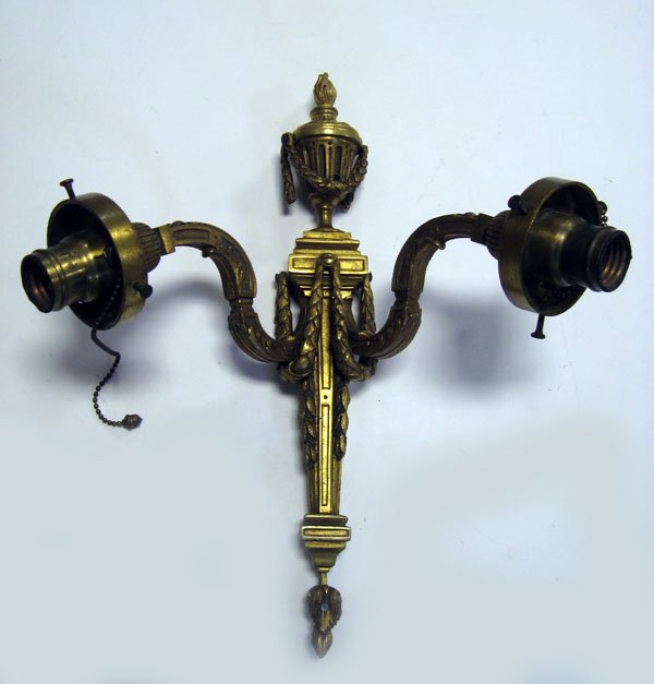 Ornate cast brass wall sconce 2 light and electric. App: Ornate cast brass wall sconce 2 light and electric. Appropriate age wear. $80-120