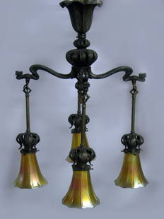 Four Steuben shades with original cast brass Art Nouvea: Four Steuben shades with original cast brass Art Nouveau hanging light fixture. Fixture needs cleaning. Shades are in good condition and have been lightly ground on top of fitter rim. The fixture is 2