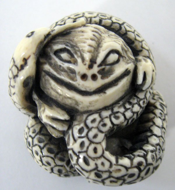 Ivory Netsuke, snake devouring it's prey. $80-120: Ivory Netsuke, snake devouring it's prey. $80-120
