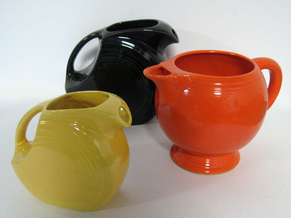 Fiesta red ice lip & 2 disc pitchers. Yellow in good sh: Fiesta red ice lip & 2 disc pitchers. Yellow in good shape and black with minor scratches. Red ice lip pitcher has a hairline crack. Appropriate age wear. $60-100