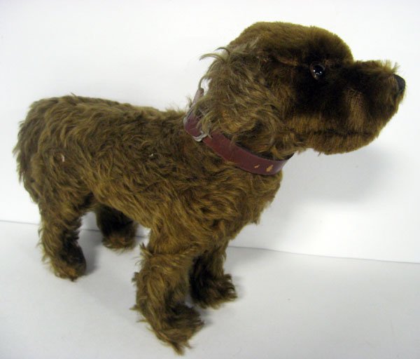 Antique 12'' dark brown mohair dog. Ca 1930-1940. Germa: Antique 12'' dark brown mohair dog. Ca 1930-1940. German, unjointed, with collar, original glass eyes and nose. No ID. Possibly Steiff. Excelsior stuffed. Approx. 70-90% mohair present. Worn on feet. 