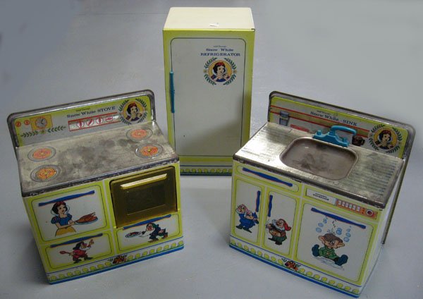 Snow White tin kitchen set. Very good overall, surface: Snow White tin kitchen set. Very good overall, surface wear to sink and stove top. Appropriate age wear. $120-150