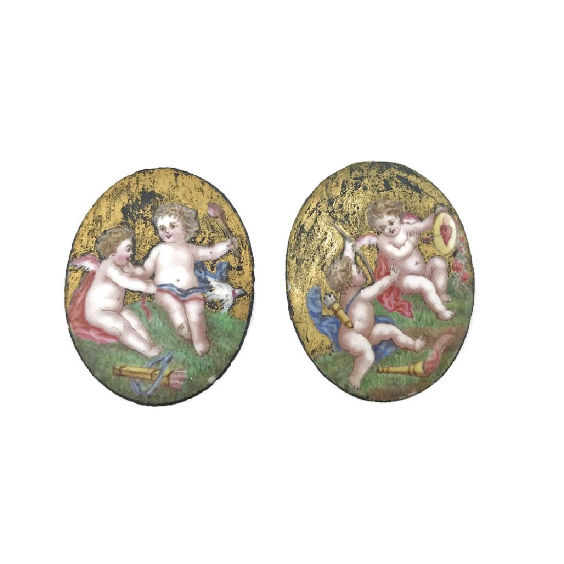 Pair of Continental miniature plaques with cupids (1 of 2)