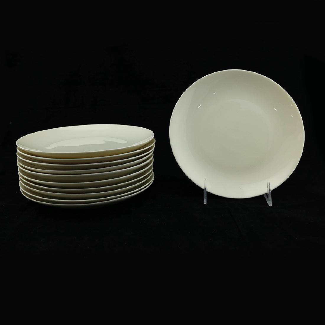 Eva Zeisel, 12 Museum Service Circular Salads: Eva Zeisel, twelve "Off Center" circular Salad Plates, Museum Service, Castleton China, New Castle, PA, designed 1942-1943. All with black Castleton lyre marks. Dia. 8 3/8 in. (21.2 cm). 1620-136 (Par