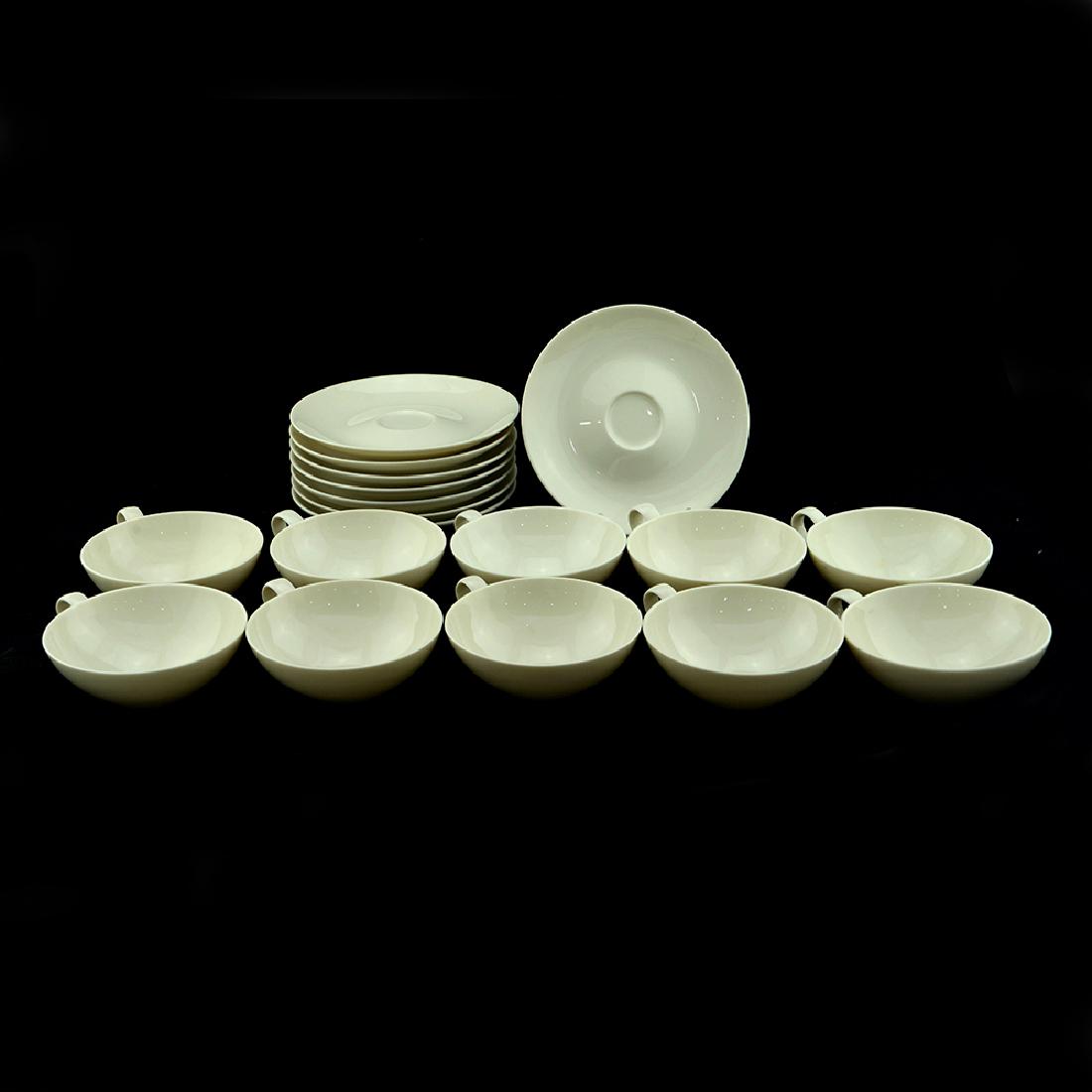 Eva Zeisel, 12 Museum cups, 11 Saucers: Eva Zeisel, twelve Teacups (so-called "Flat Cups") and eleven Saucers, Museum Service, Castleton China, New Castle, PA, designed 1942-1943. All but one cup and saucer with the black Castleton lyre mar