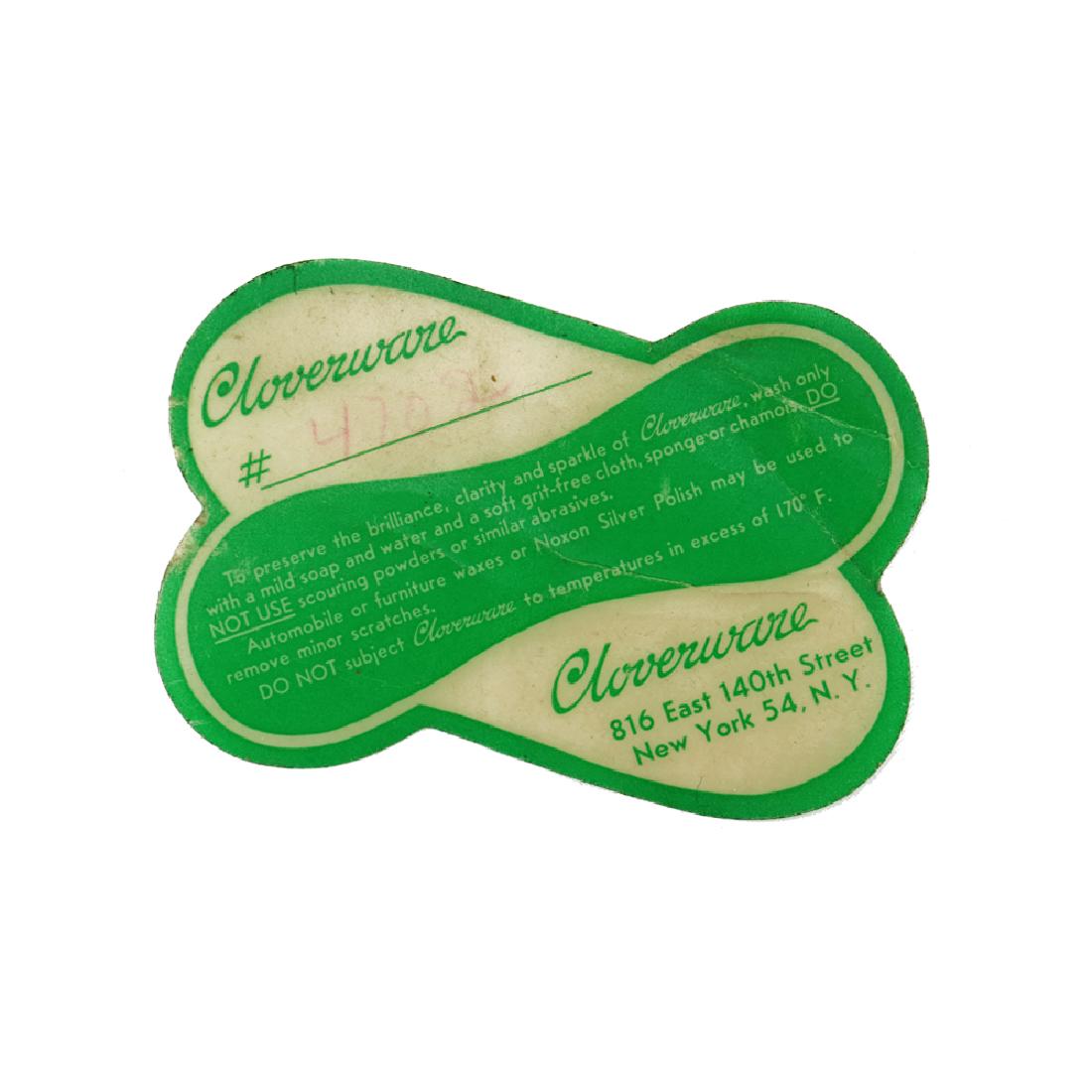 A Rare Cloverware Trade Label: A green and white printed trade label for Cloverware with care instructions, Clover Box and Manufacturing Company, Clover Box and Manufacturing Company, Bronx, New York. 3 1/4 x 2 1/4 in. (8.2 x 5.5 c
