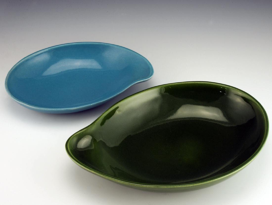 Eva Zeisel, 2 Town & Country Comma Bowls: Eva Zeisel, Two "Comma Bowls," the first a Baker in Forest Green glaze, the second for Relish in Dusk Blue, Town and Country, Red Wing Potteries, Red Wing, Minnesota, designed 1947. Baker: 10 3/4 x 7