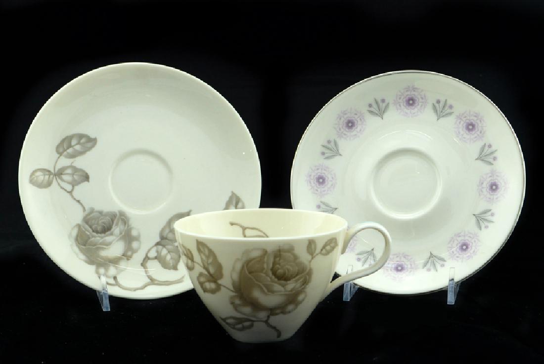 Eva Zeisel, Museum Service Cups & Saucers: Eva Zeisel, a Teacup and Saucer from the Museum Service, grisaille Dawn Rose pattern, together with a Saucer in the Scandia pattern, Castleton China, New Castle, PA, the shapes designed 1942-1943. Wit