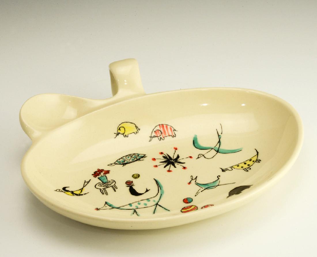Eva Zeisel, Wee Modern Loop-Handled Dish: Eva Zeisel, Loop-Handled Dish for feeding an infant, Wee Modern, Goss China, Chatham, New Jersey, circa 1951. The underside stamped "WEE MODERN" by Eva Zeisel. Goss China in black. Porcelain, transfer