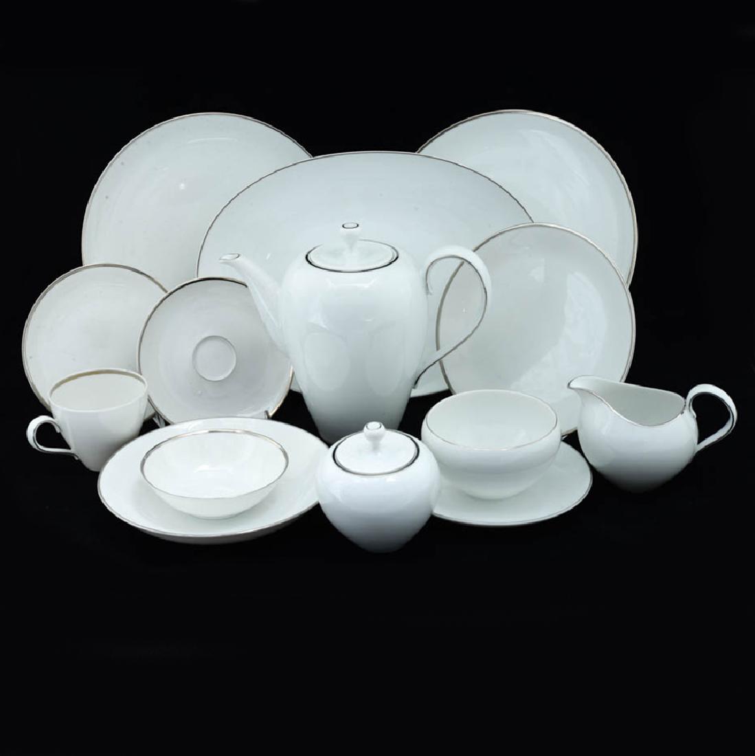 Zeisel Rosenthal part Dinner/Coffee Set: Eva Zeisel, a part Dinner and Coffee Service comprising a Coffee Pot with lid, a Creamer, a Sugar Bowl with lid, a Cup and Saucer, a 13" oval Platter, two 10 1/4" Dinner Plates, a 7 1/2" plate, a 6" p
