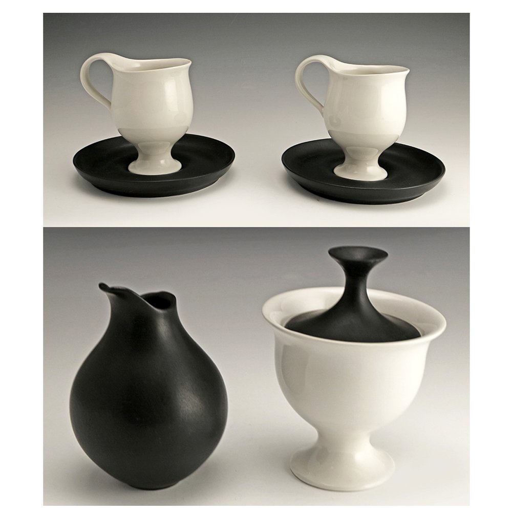 Very Rare Zeisel Hyalyn B&W Group: Eva Zeisel, an extremely rare group in clear and matte black glaze comprising a Covered Sugar, a Creamer, and pair of Cups and Saucers, High Fashion, Hyalyn Porcelain, Hickory, NC, 1964. Porcelain. Th
